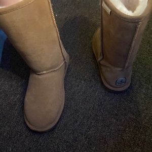 Tall bear paw fur boots.